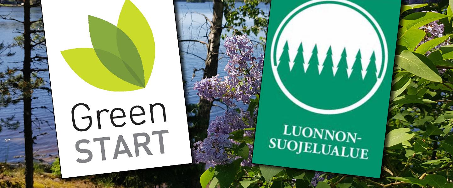 GreenStart- ja luonnonsuojelualuemerkki Lehmirannan lomakeskuksen järvimaisemassa otetun kuvan päällä.